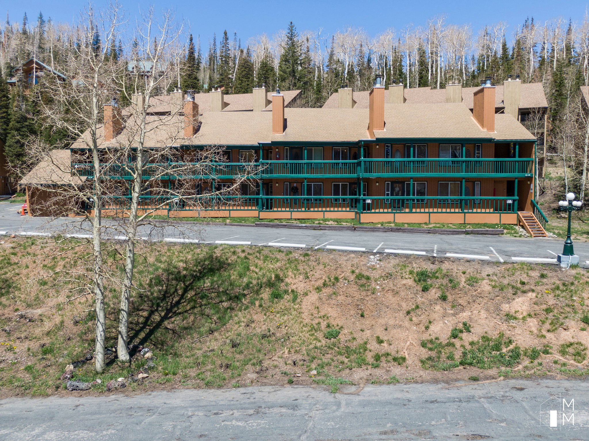 View of building exterior featuring view of scattered trees