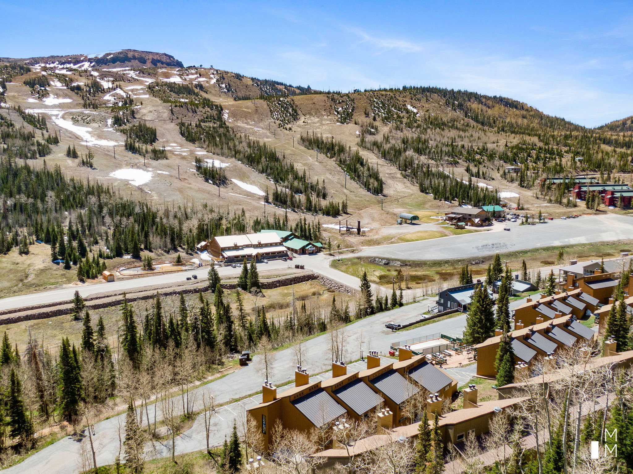 Aerial overview of property's location with a mountainous background