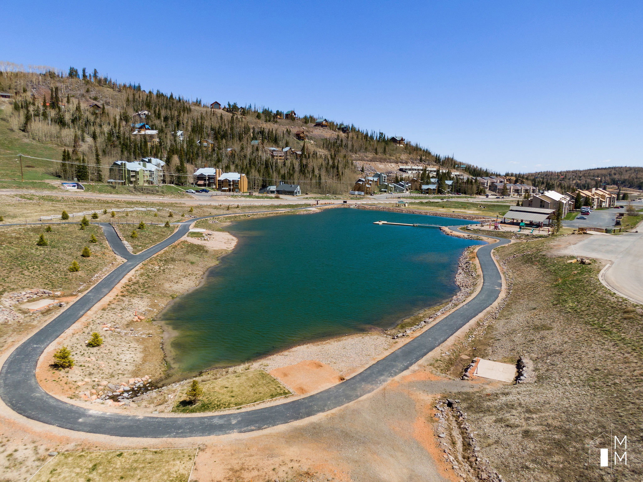 Aerial overview of property's location with a nearby body of water