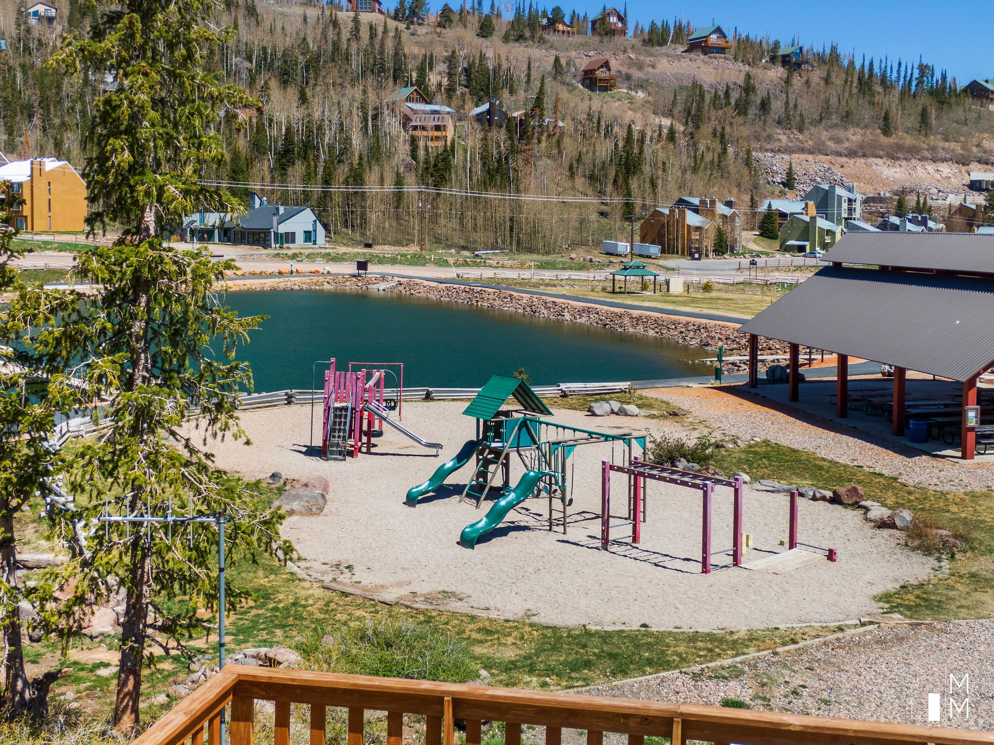 Community playground featuring a water view