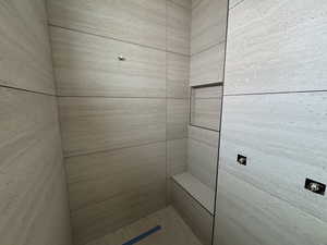 Full bathroom featuring tiled shower