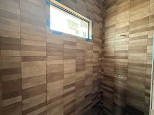 Full bathroom with a tile shower