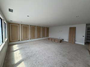 Spare room featuring baseboards