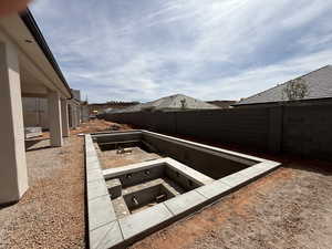 Fenced backyard featuring a patio area