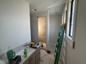 Full bath featuring a sink and walk in shower