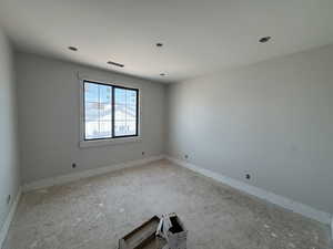 Unfurnished room with baseboards
