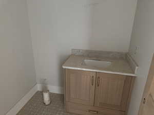 Bathroom with vanity and light tile patterned floors