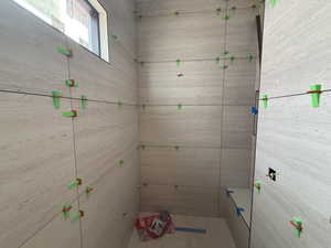 Bathroom with tiled shower