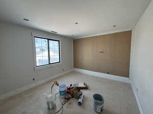 Empty room featuring baseboards