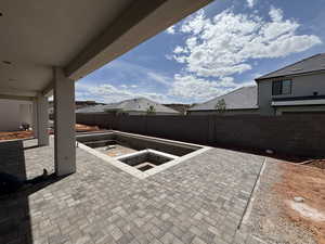 Fenced backyard featuring a patio