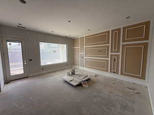 Unfurnished room with baseboards