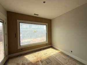 Empty room featuring baseboards