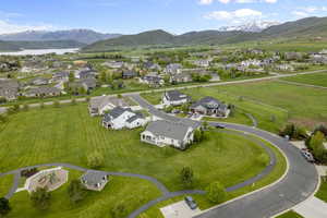Aerial view of residential area featuring a mountainous background