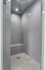 Bathroom featuring tiled shower
