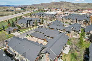 Aerial perspective of suburban area featuring a mountainous background