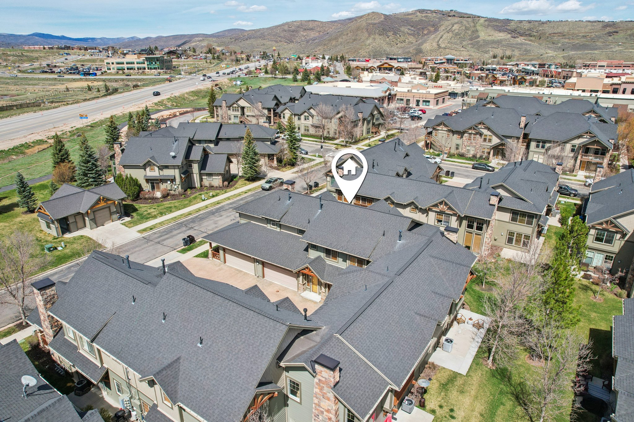 Aerial view of residential area featuring mountains