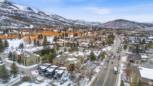 Snowy aerial view with a mountain view