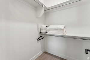 Walk in closet featuring light wood-type flooring
