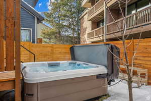 View of patio featuring a hot tub