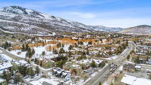 View of mountain backdrop with nearby suburban area