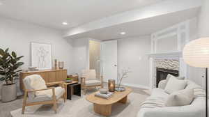 Living area with light colored carpet, a tiled fireplace, and recessed lighting