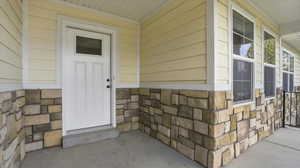 Property entrance with stone siding