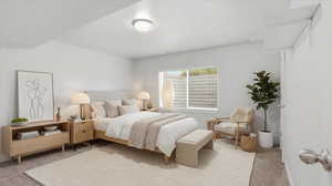 Bedroom with light carpet and baseboards
