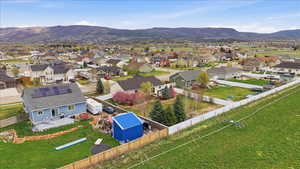 Aerial view of residential area featuring mountains