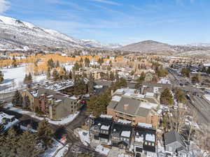 Snowy aerial view featuring a mountain view