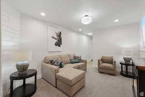 Living room with recessed lighting and baseboards