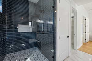 Full bathroom with a shower stall