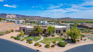 View of front of property featuring a mountain view, a residential view, and stucco siding