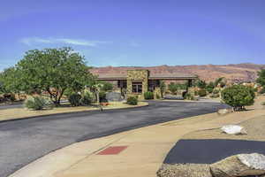 View of asphalt street with a mountain view and curbs