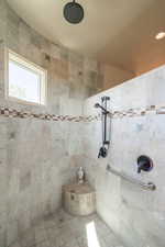 Full bathroom with tiled shower