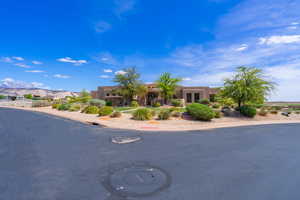 Adobe home featuring stucco siding