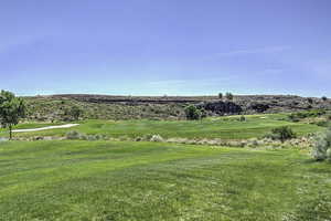 View of grassy yard with golf course view