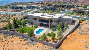 Aerial view of residential area with mountains and a pool area