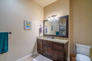 Full bathroom featuring vanity and toilet