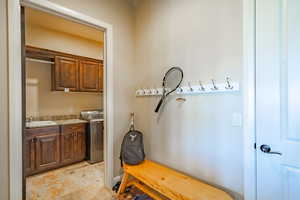 Mudroom with washer / dryer and a sink