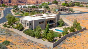 View from above of property with a mountain backdrop and a pool