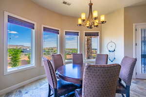 Dining room featuring suspended lighting and baseboards