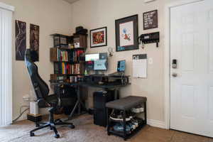 Office space featuring baseboards and tile patterned flooring