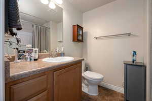 Full bathroom featuring vanity and a shower with shower curtain