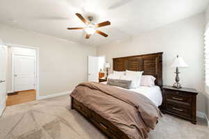 Bedroom featuring light colored carpet and a ceiling fan