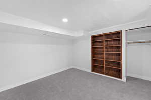 Unfurnished bedroom with carpet, a closet, and a textured ceiling