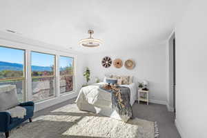 Bedroom with carpet flooring and a mountain view