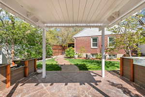 Fenced backyard featuring a patio