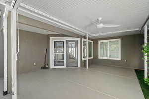 Bright, clean, covered patio with ceiling fan