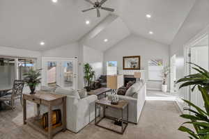 Walking through front door, view of the vaulted great room, fireplace and back patio door.