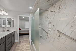 Primary walk in shower with grab bars